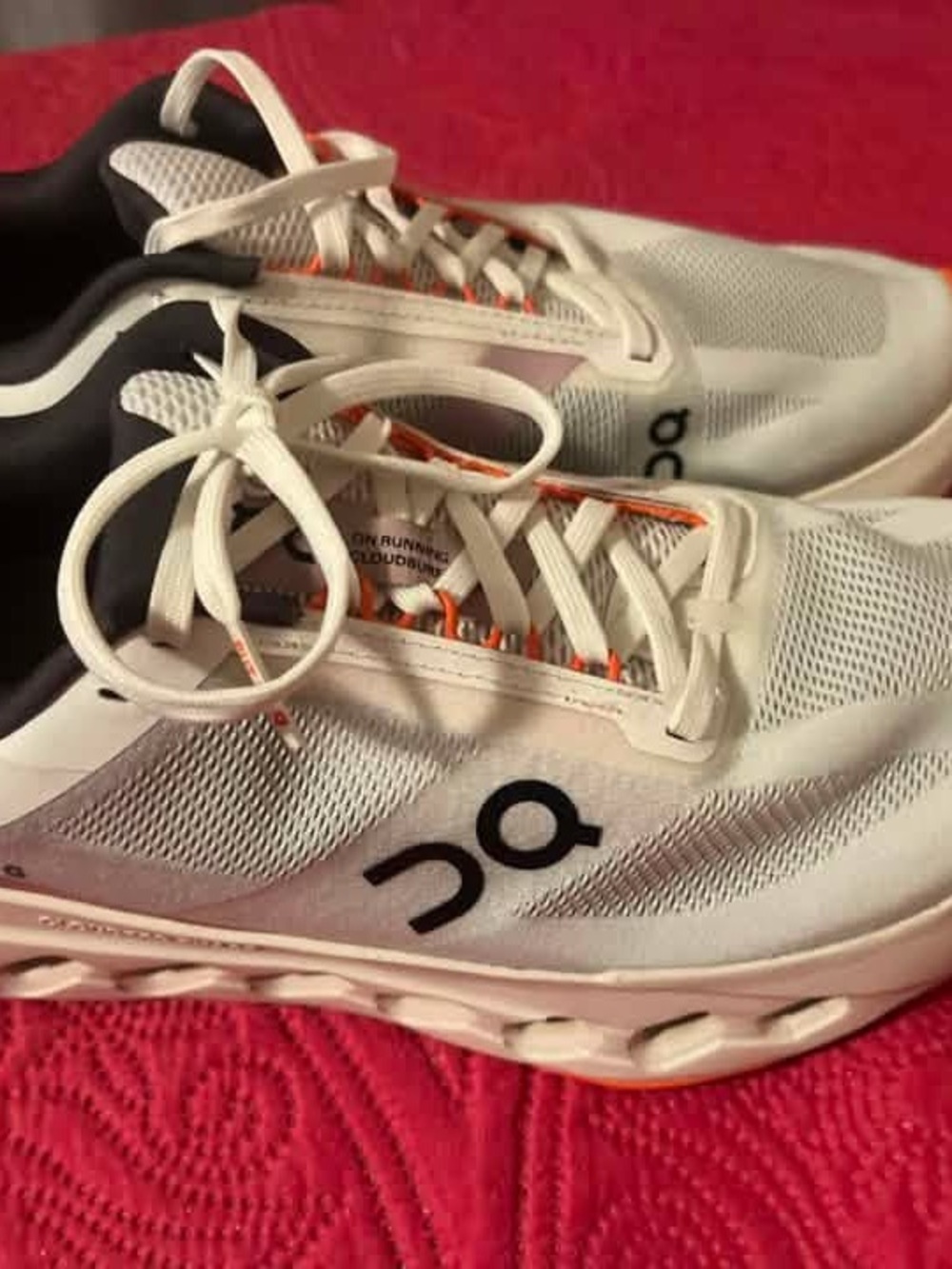 On Running women’s White Sneakers with Black Logo and Orange Accents size 10